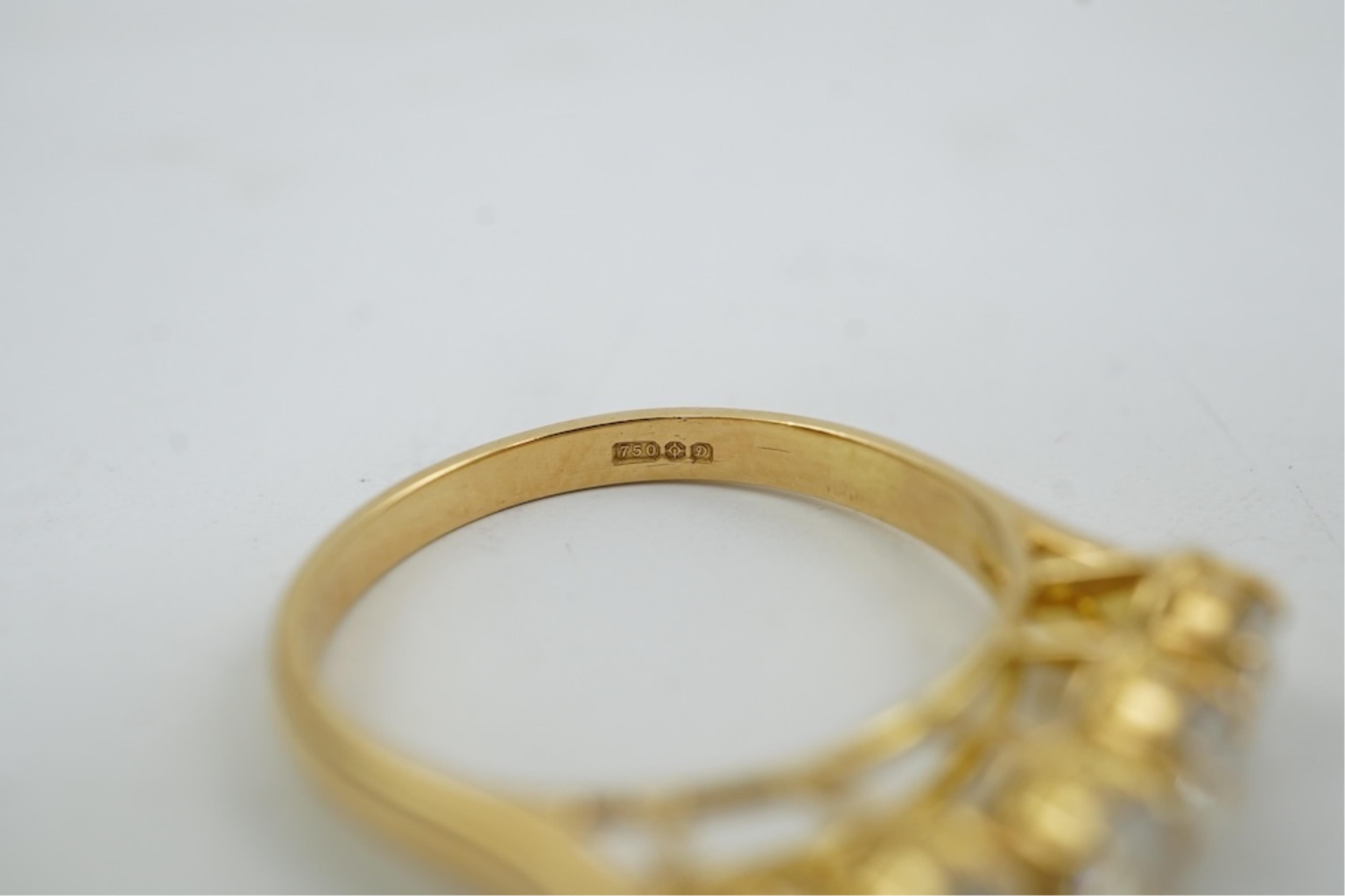 A modern 18ct gold and five stone oval cut diamond set half hoop ring, size N, gross weight 3.8 grams.